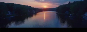 a serene sunset over a picturesque lake in watertown, ct.